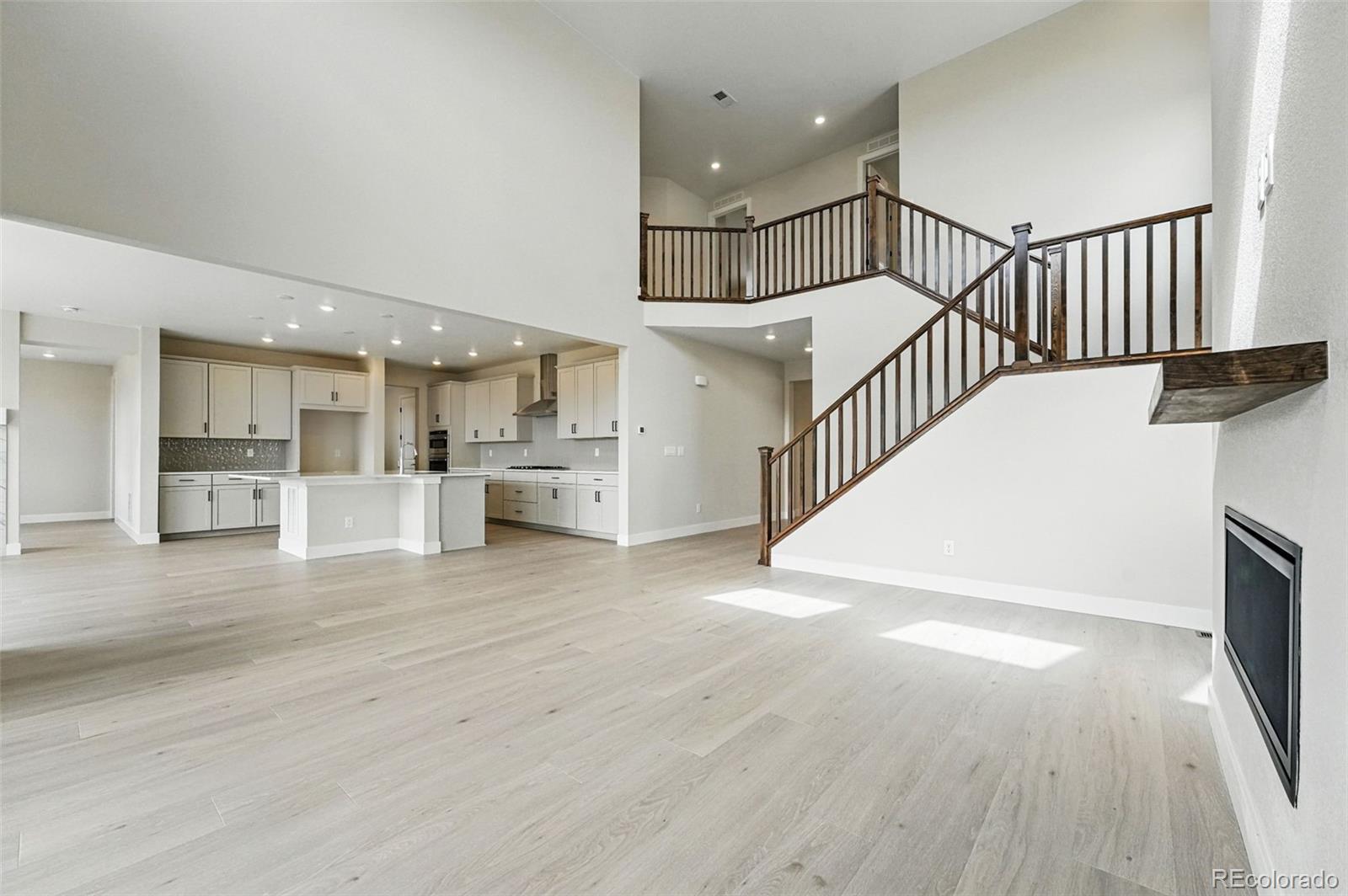 5722 Farrier Point Castle Rock, CO 80104 - Photo 13 of 41 a view of entryway and hall with wooden floor