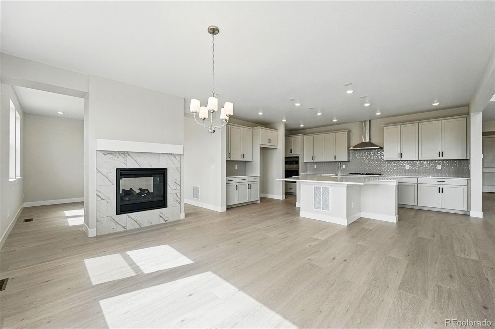 5722 Farrier Point Castle Rock, CO 80104 - Photo 15 of 41 a view of kitchen with granite countertop cabinets and stainless steel appliances