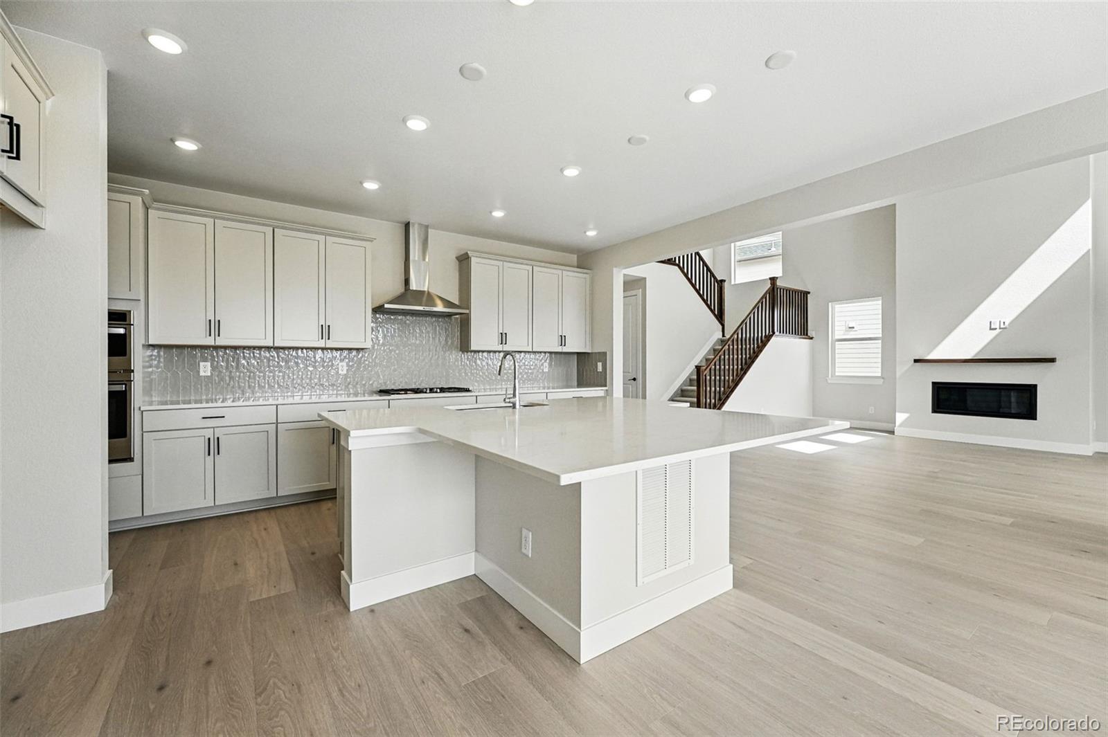 5722 Farrier Point Castle Rock, CO 80104 - Photo 16 of 41 a kitchen with a sink stainless steel appliances and cabinets