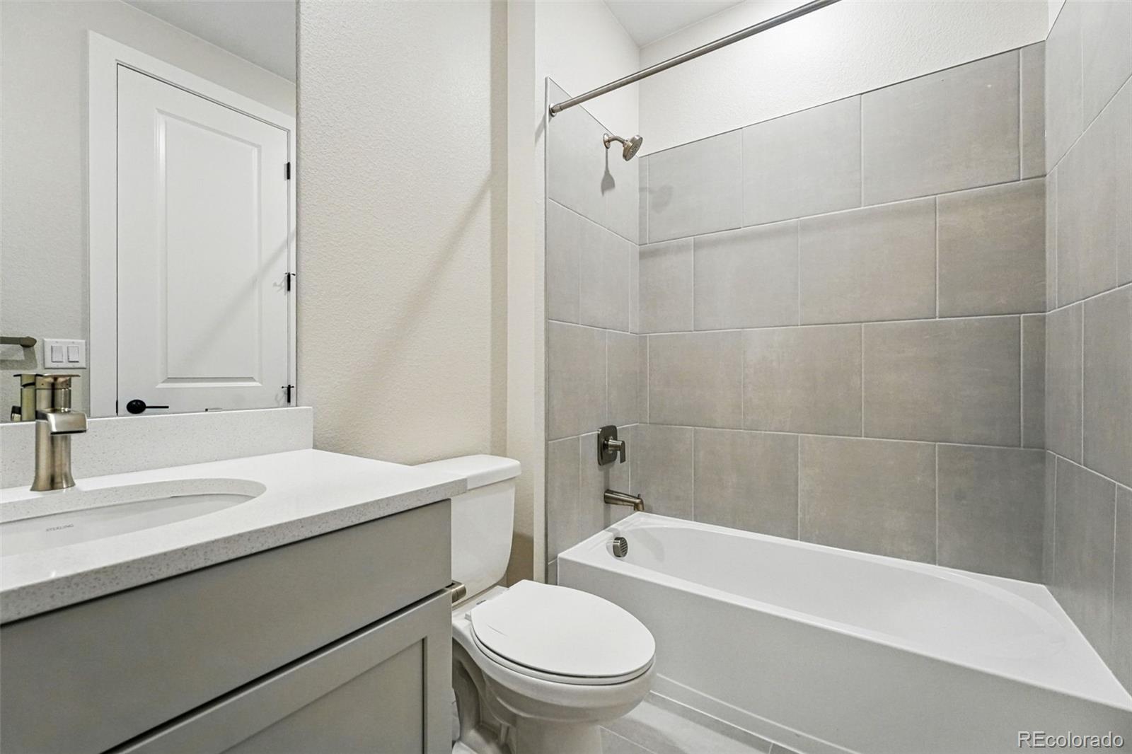 5722 Farrier Point Castle Rock, CO 80104 - Photo 26 of 41 a bathroom with a sink a toilet and a bathtub