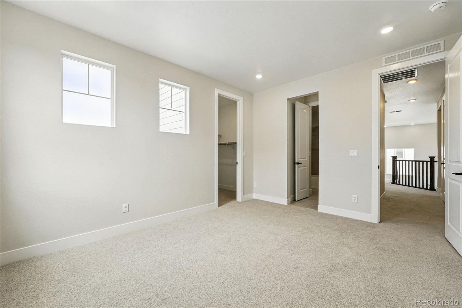 5722 Farrier Point Castle Rock, CO 80104 - Photo 29 of 41 an empty room with windows and closet