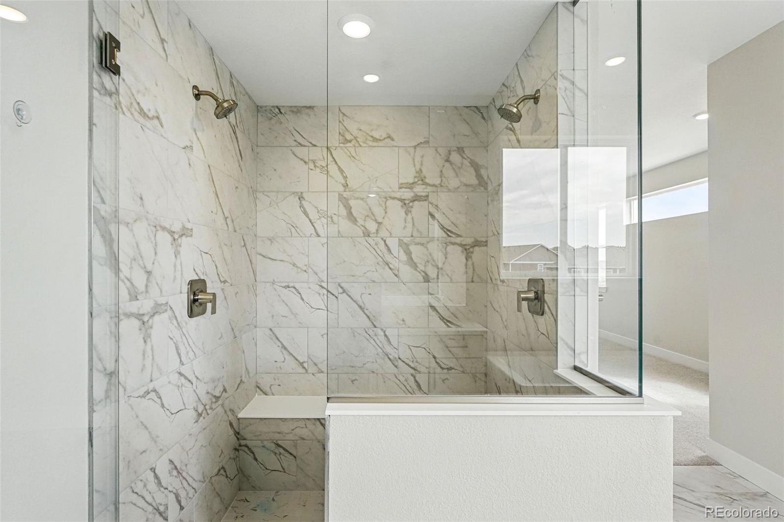 5722 Farrier Point Castle Rock, CO 80104 - Photo 6 of 41 a bathroom with a bathtub and a shower