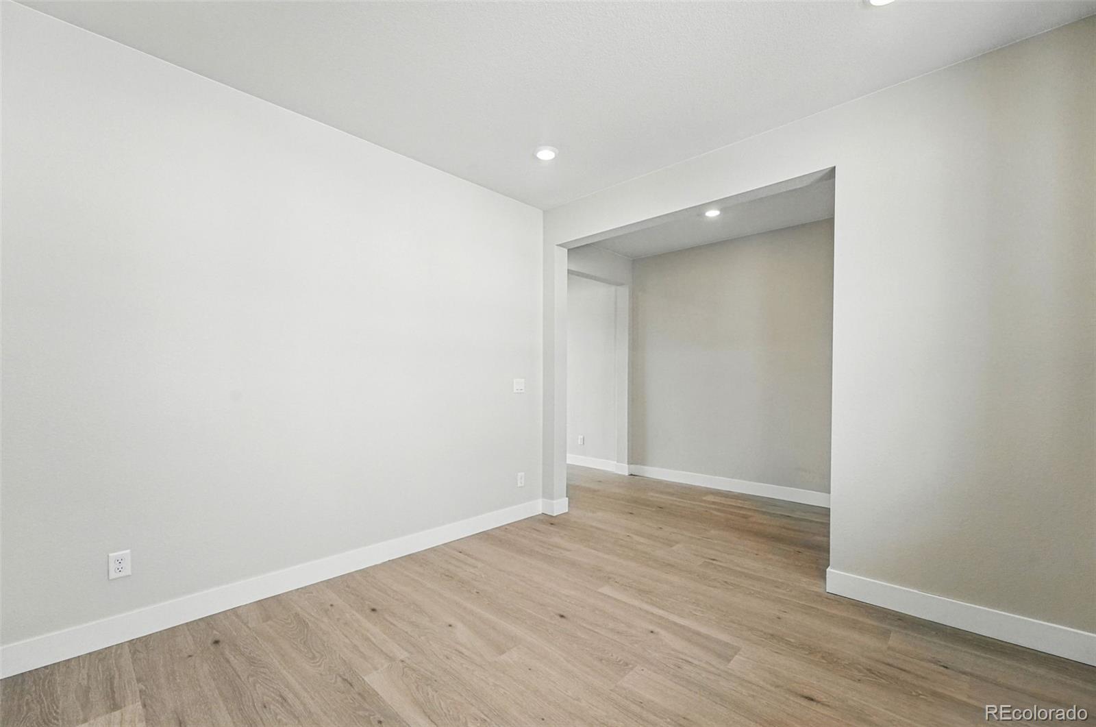 5722 Farrier Point Castle Rock, CO 80104 - Photo 10 of 41 a view of an empty room with wooden floor
