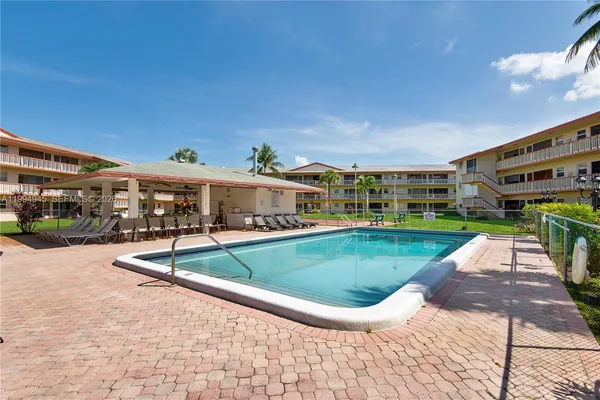 a view of a swimming pool with a patio