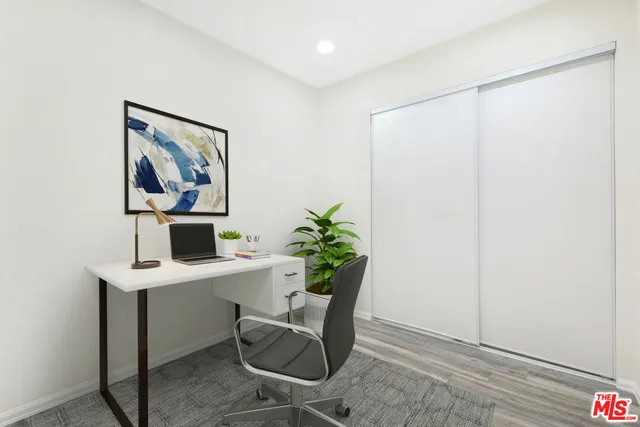 a workspace with furniture and desk