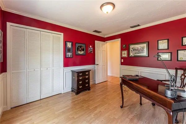 a livingroom with furniture a piano and wooden floor