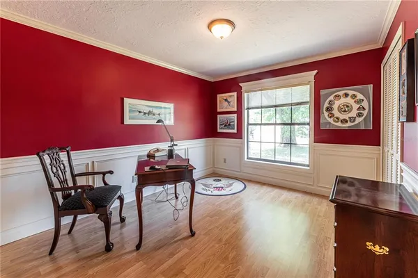 a view of a livingroom with furniture window and wooden floor