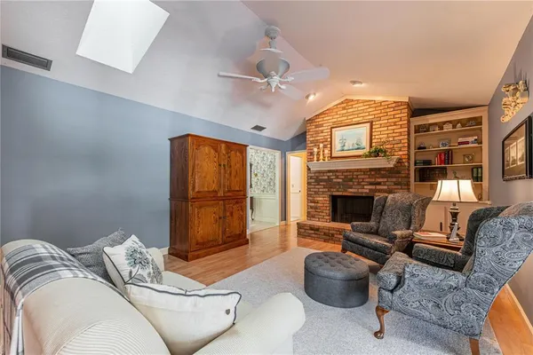 a bedroom with furniture and a fireplace