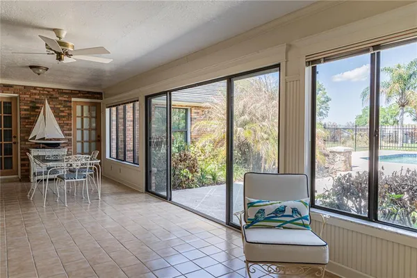 a dining room with furniture water view and wooden floor
