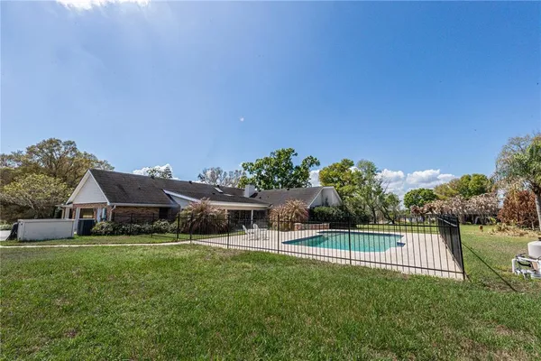 a view of house with a big yard
