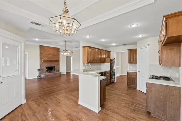 a kitchen with a sink and large window