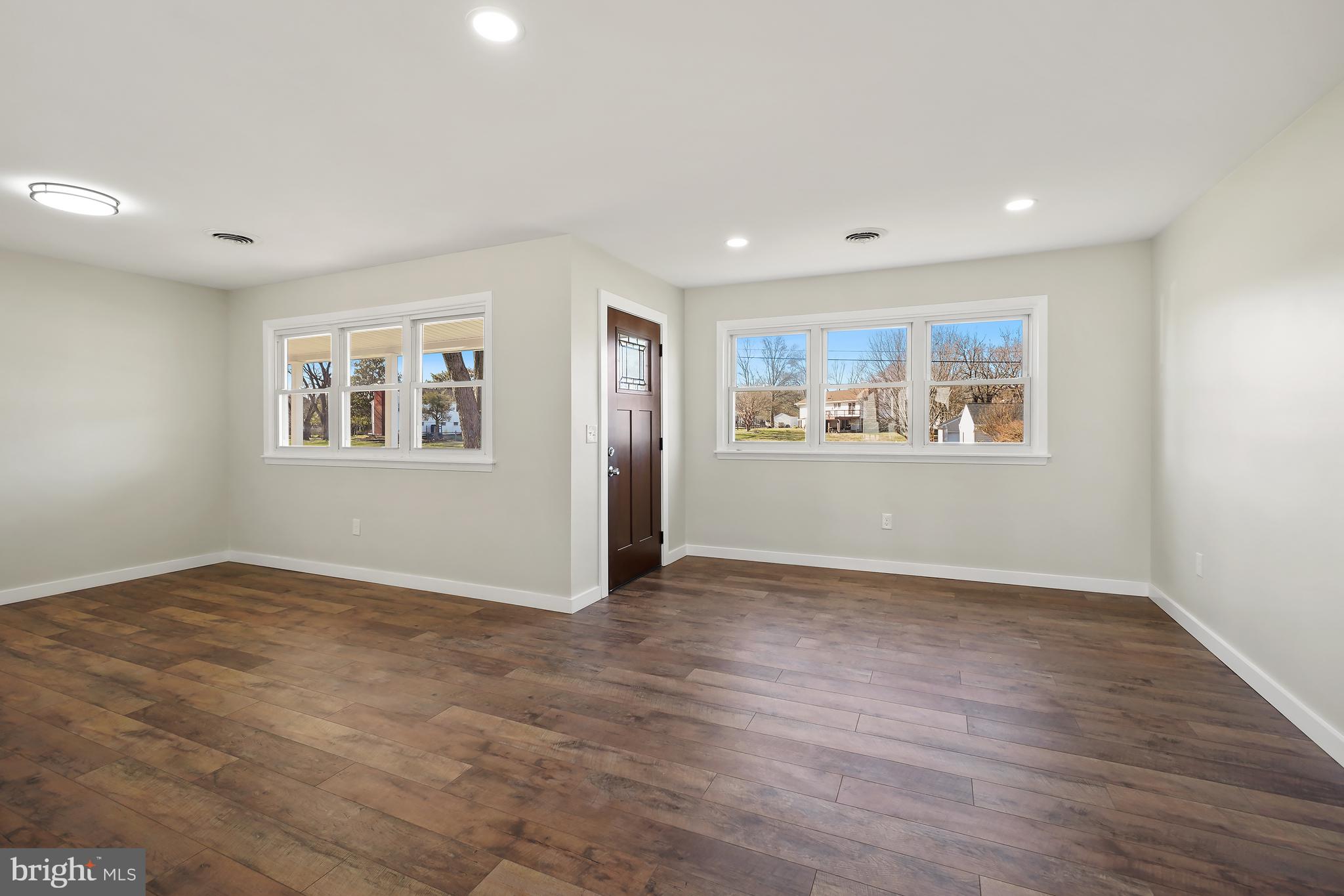 1546 Ridgely Drive Edgewater, MD 21037 - Photo 12 of 55 a view of empty room with wooden floor and window