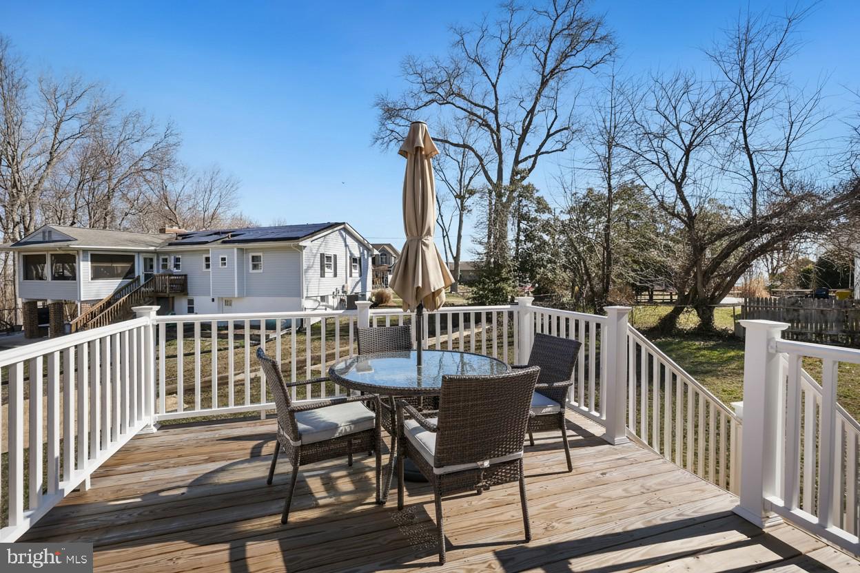 1546 Ridgely Drive Edgewater, MD 21037 - Photo 20 of 55 a view of a chair and table on the deck