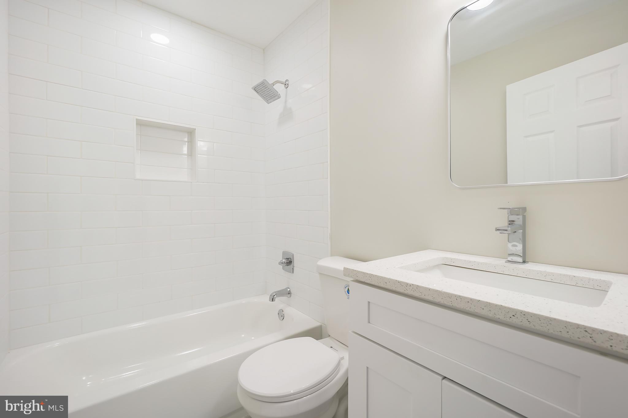 1546 Ridgely Drive Edgewater, MD 21037 - Photo 28 of 55 a bathroom with a sink toilet vanity and bathtub