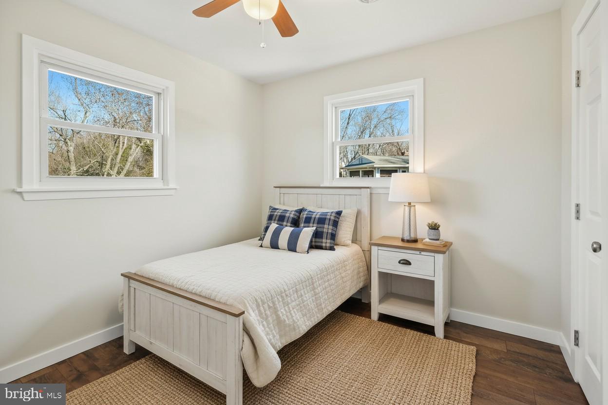 1546 Ridgely Drive Edgewater, MD 21037 - Photo 30 of 55 a bedroom with a bed and a lamp on dresser