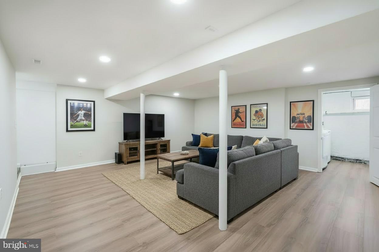 1546 Ridgely Drive Edgewater, MD 21037 - Photo 39 of 55 a living room with furniture and a flat screen tv