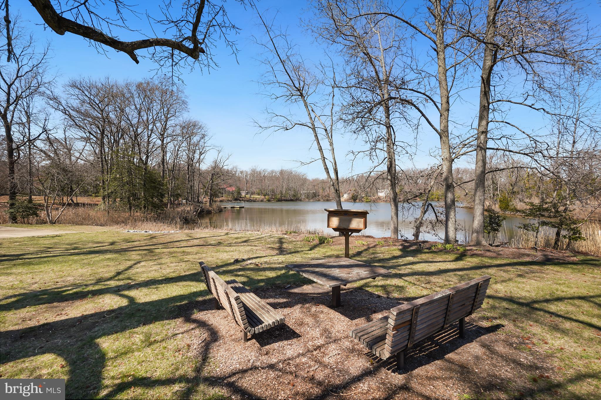 1546 Ridgely Drive Edgewater, MD 21037 - Photo 53 of 55 a view of a lake with couches and trees