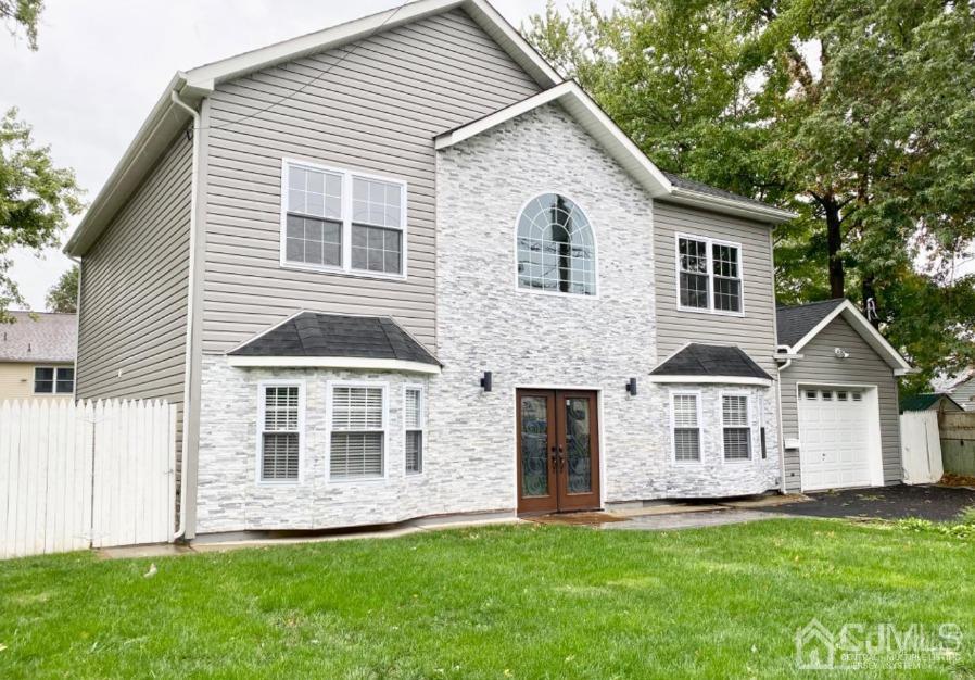 10 Idlewild Road Edison, NJ 08817 - Photo 1 of 21 a front view of a house with a garden