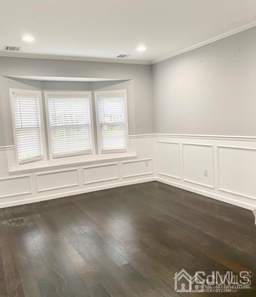 10 Idlewild Road Edison, NJ 08817 - Photo 17 of 21 an empty room with wooden floor and window