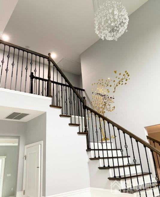 10 Idlewild Road Edison, NJ 08817 - Photo 19 of 21 a view of staircase with railing and white walls