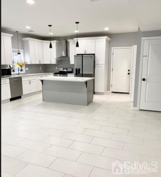 10 Idlewild Road Edison, NJ 08817 - Photo 3 of 21 a large kitchen with cabinets and stainless steel appliances