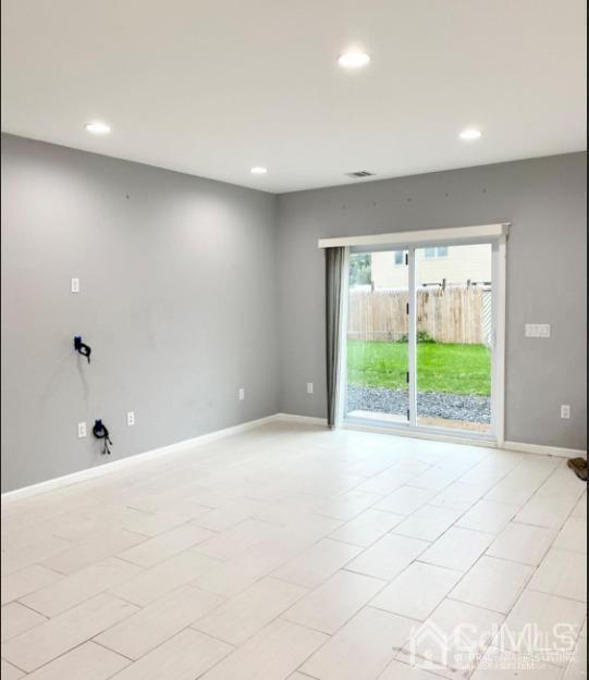 10 Idlewild Road Edison, NJ 08817 - Photo 5 of 21 a view of an empty room with a window