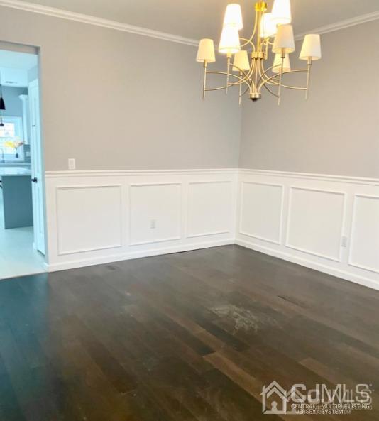 10 Idlewild Road Edison, NJ 08817 - Photo 6 of 21 en empty room with wooden floor