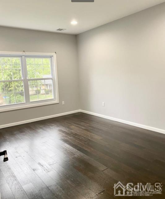 10 Idlewild Road Edison, NJ 08817 - Photo 10 of 21 an empty room with wooden floor and windows