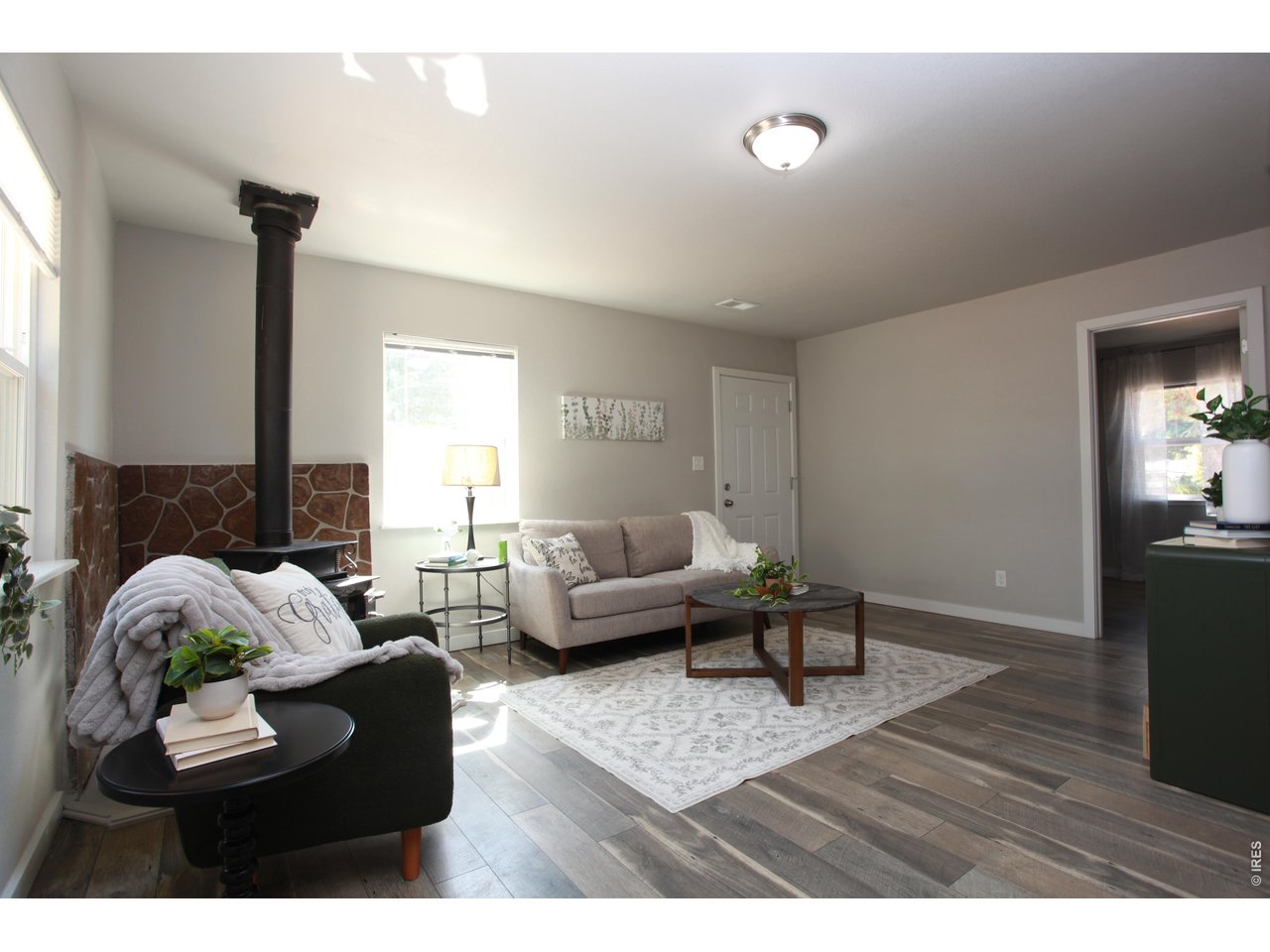 2908 West Olive Street Fort Collins, CO 80521 - Photo 2 of 20 a living room with furniture and a wooden floor
