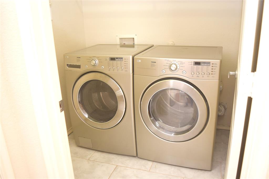 1714 Rustic Lane Garland, TX 75040 - Photo 13 of 20 a utility room with dryer and washer