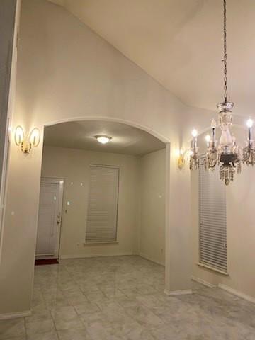 1714 Rustic Lane Garland, TX 75040 - Photo 17 of 20 a view of a chandelier in big room and chandelier