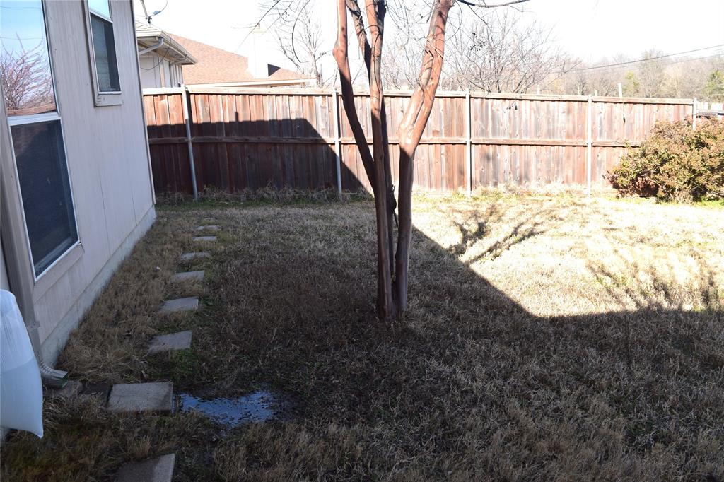 1714 Rustic Lane Garland, TX 75040 - Photo 19 of 20 a view of a backyard of the house