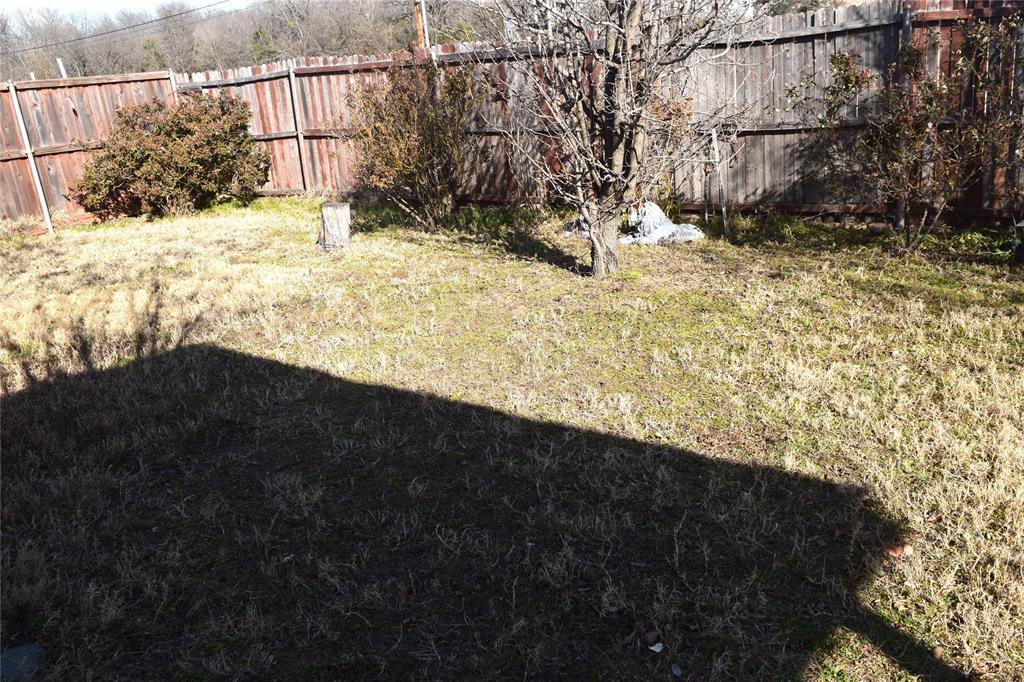 1714 Rustic Lane Garland, TX 75040 - Photo 20 of 20 a view of a yard covered in snow