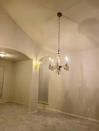 a view of a chandelier fan in a room