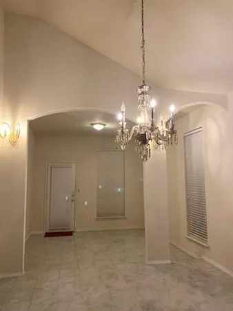 a view of a chandelier in a room and a chandelier fan