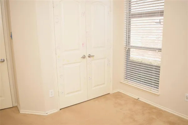 a view of a room that has a window in it
