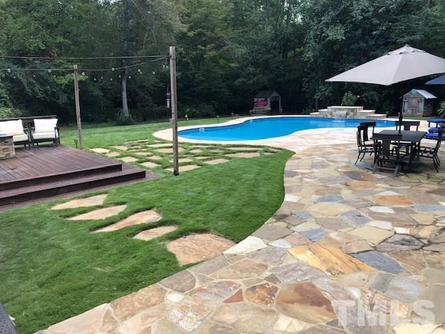800 Hardimont Road Raleigh, NC 27609 - Photo 2 of 26 a view of a backyard with sitting area