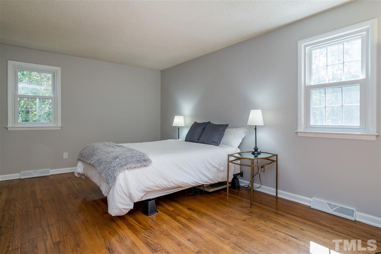 800 Hardimont Road Raleigh, NC 27609 - Photo 11 of 26 a bedroom with a bed and a window