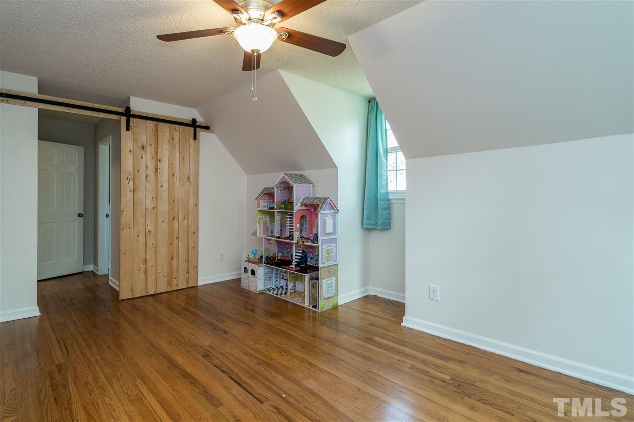 800 Hardimont Road Raleigh, NC 27609 - Photo 14 of 26 wooden floor in an empty room with a window