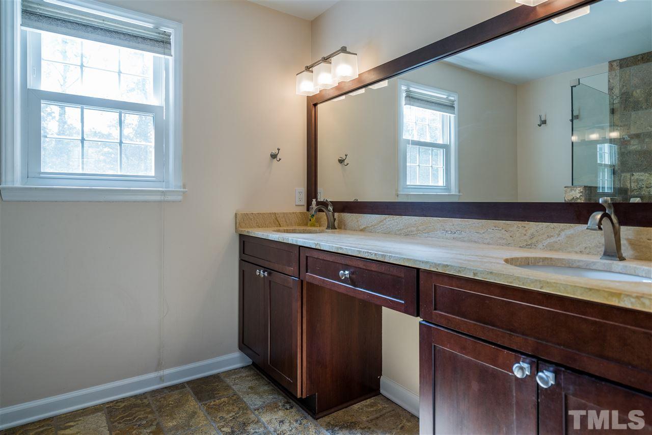800 Hardimont Road Raleigh, NC 27609 - Photo 18 of 26 a bathroom with a sink and a mirror