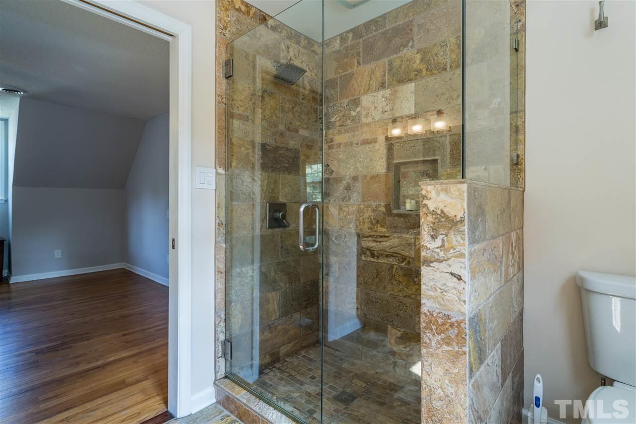800 Hardimont Road Raleigh, NC 27609 - Photo 19 of 26 a bathroom with a glass shower door