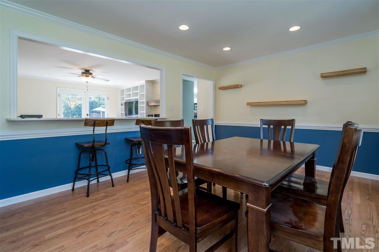 800 Hardimont Road Raleigh, NC 27609 - Photo 8 of 26 a view of a dining room with furniture and wooden floor