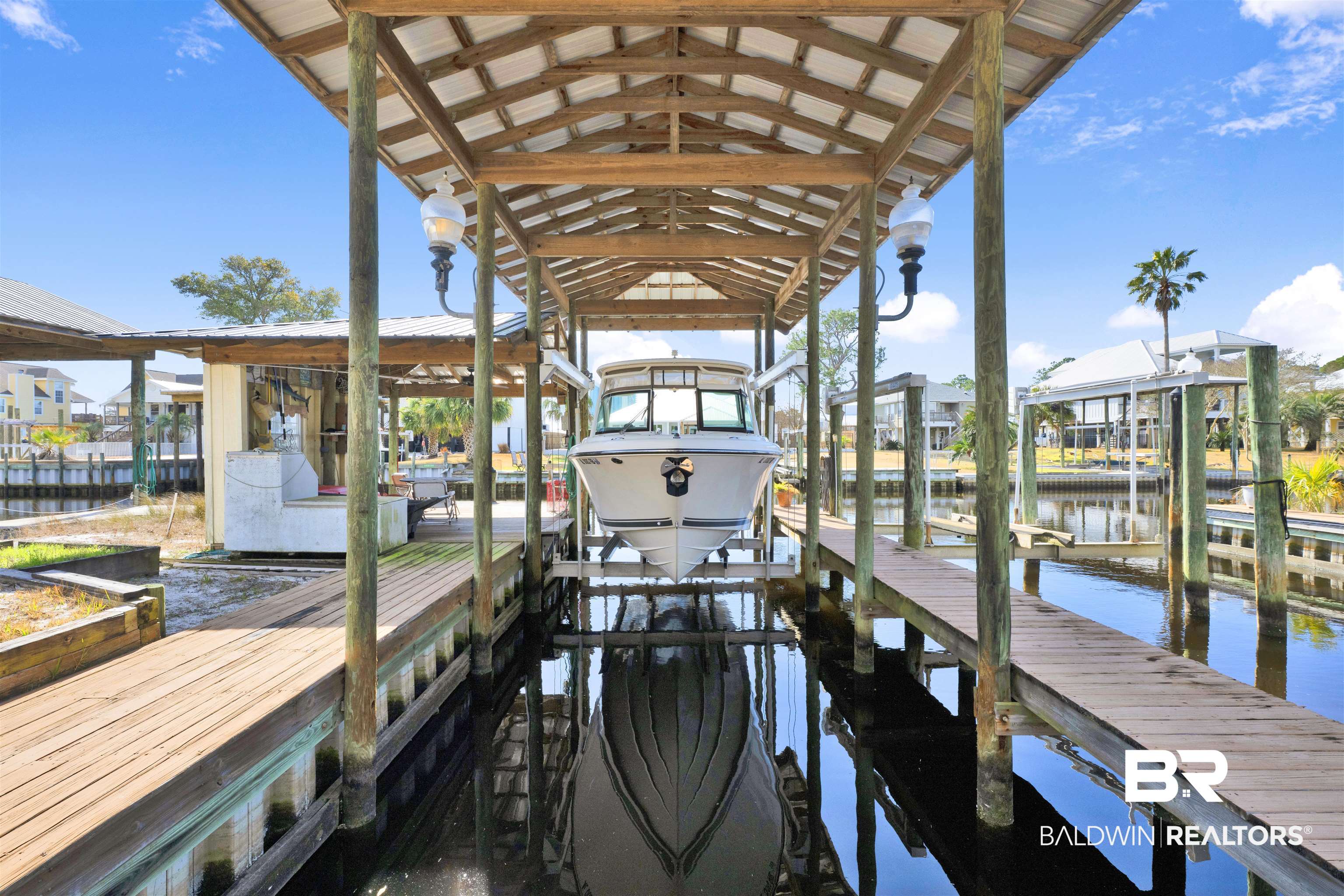 26222 Marina Road Orange Beach, AL 36561 - Photo 4 of 38 Dock area with boat lift and a water view
