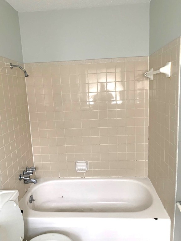 2609 East Cesar Chavez Street, Unit 204 Austin, TX 78702 - Photo 8 of 10 a bathroom with a bathtub and shower