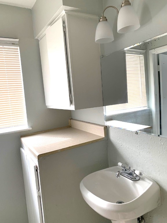 2609 East Cesar Chavez Street, Unit 204 Austin, TX 78702 - Photo 9 of 10 a bathroom with a sink and a mirror