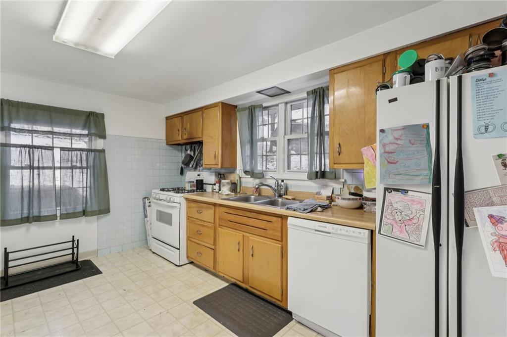 101 East Patterson Avenue Butler, PA 16001 - Photo 12 of 25 a kitchen with a sink stove and refrigerator