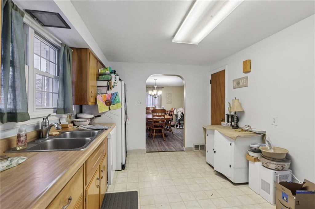 101 East Patterson Avenue Butler, PA 16001 - Photo 13 of 25 a kitchen with a sink stove and cabinets