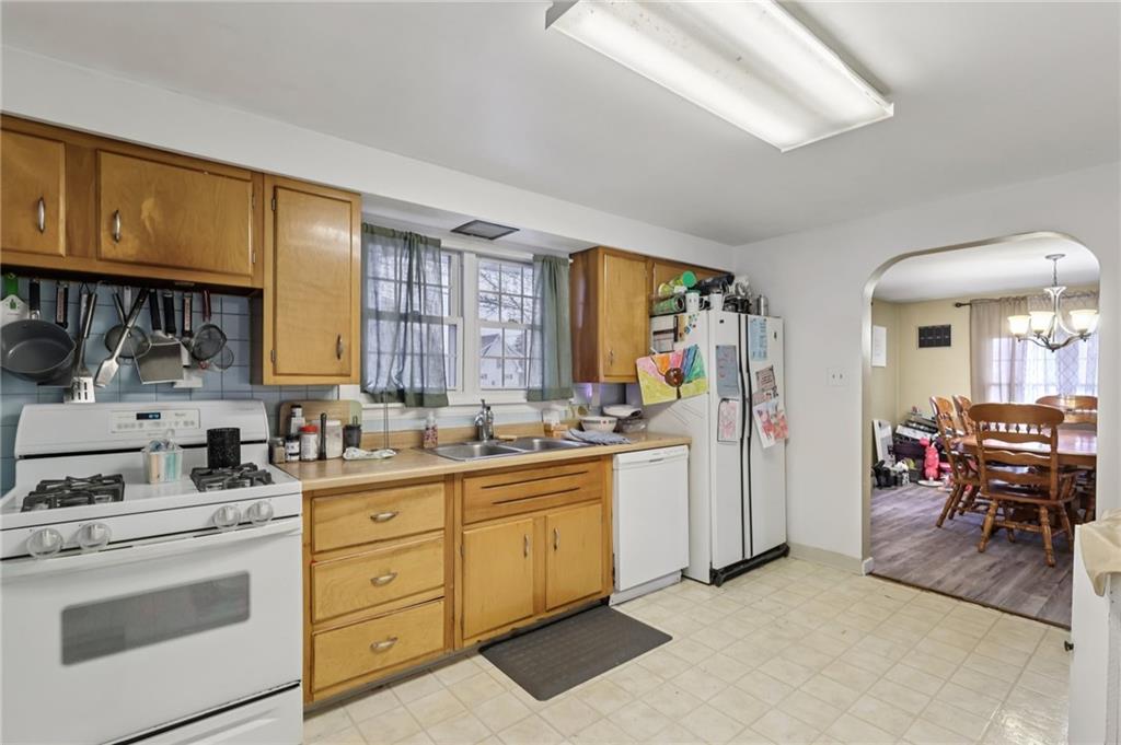101 East Patterson Avenue Butler, PA 16001 - Photo 14 of 25 a kitchen with cabinets and chairs