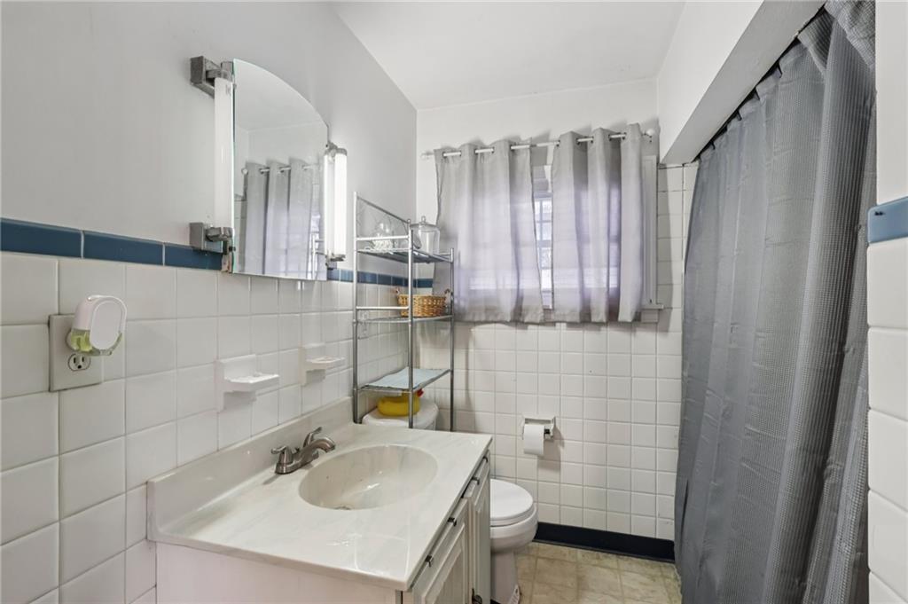 101 East Patterson Avenue Butler, PA 16001 - Photo 19 of 25 a bathroom with a sink a toilet and shower