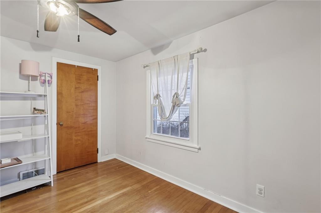 101 East Patterson Avenue Butler, PA 16001 - Photo 22 of 25 a view of an empty room with wooden floor and a window